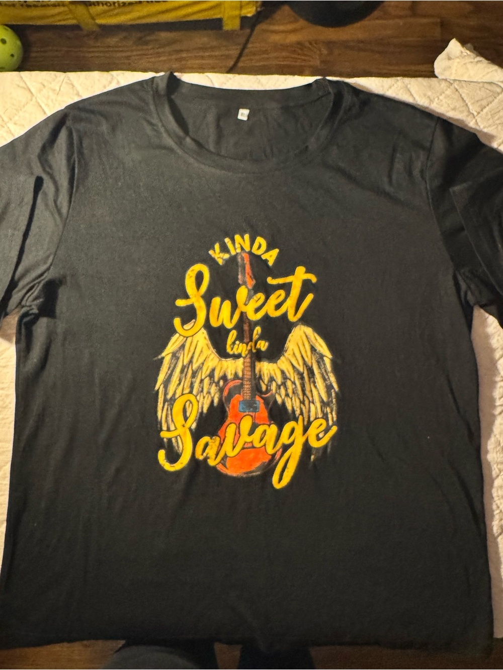 Amazon Black Graphic Tee with Yellow and Orange Guitar Wings